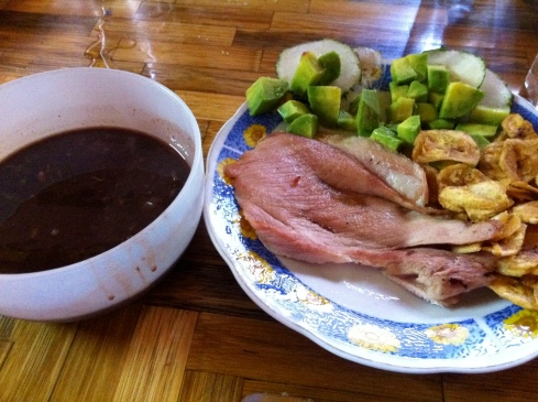 A typical Cuban lunch; pork. moneditas de platano, avocado and beans on the side (I asked them to hold the rice that day)